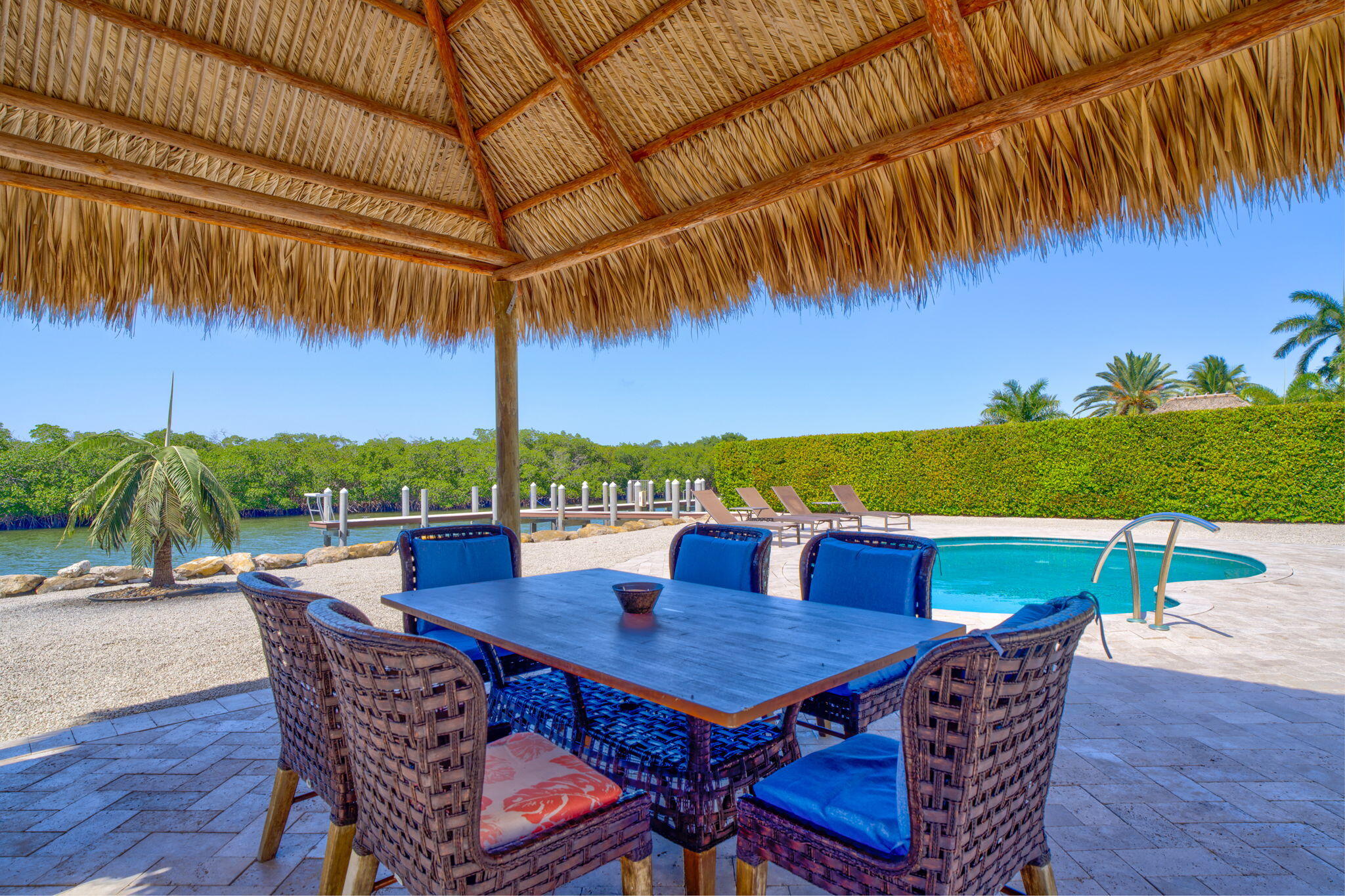 2394 Coco Plum Drive Marathon, FL 33050 - Photo 49 of 56 a view of an outdoor dining space with a table and chairs