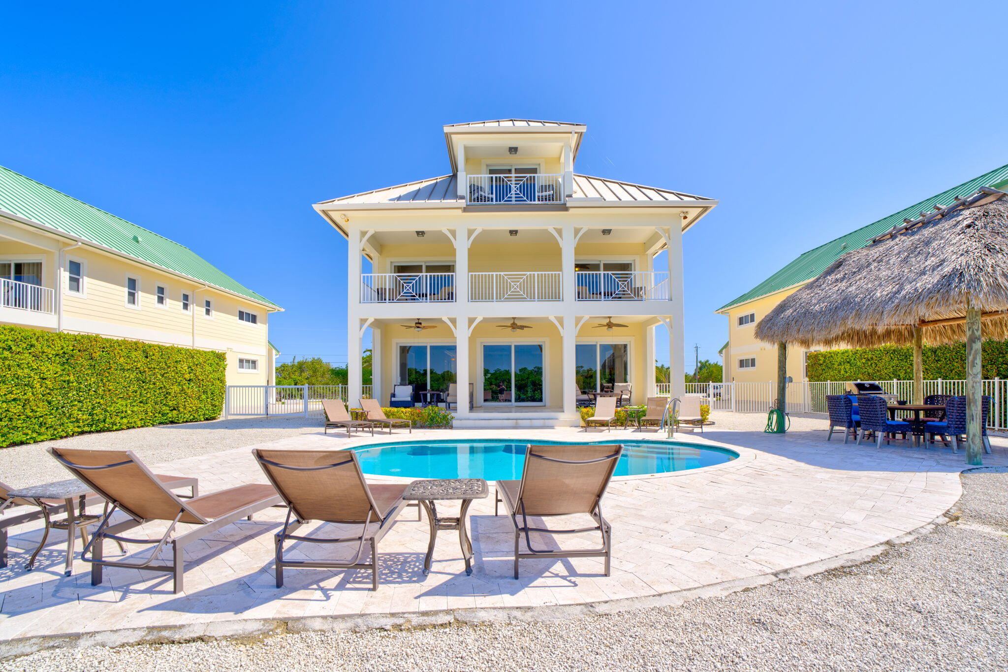 2394 Coco Plum Drive Marathon, FL 33050 - Photo 50 of 56 a view of a patio with a dining table and chairs