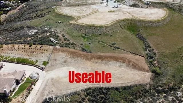 an aerial view of a city with mountains