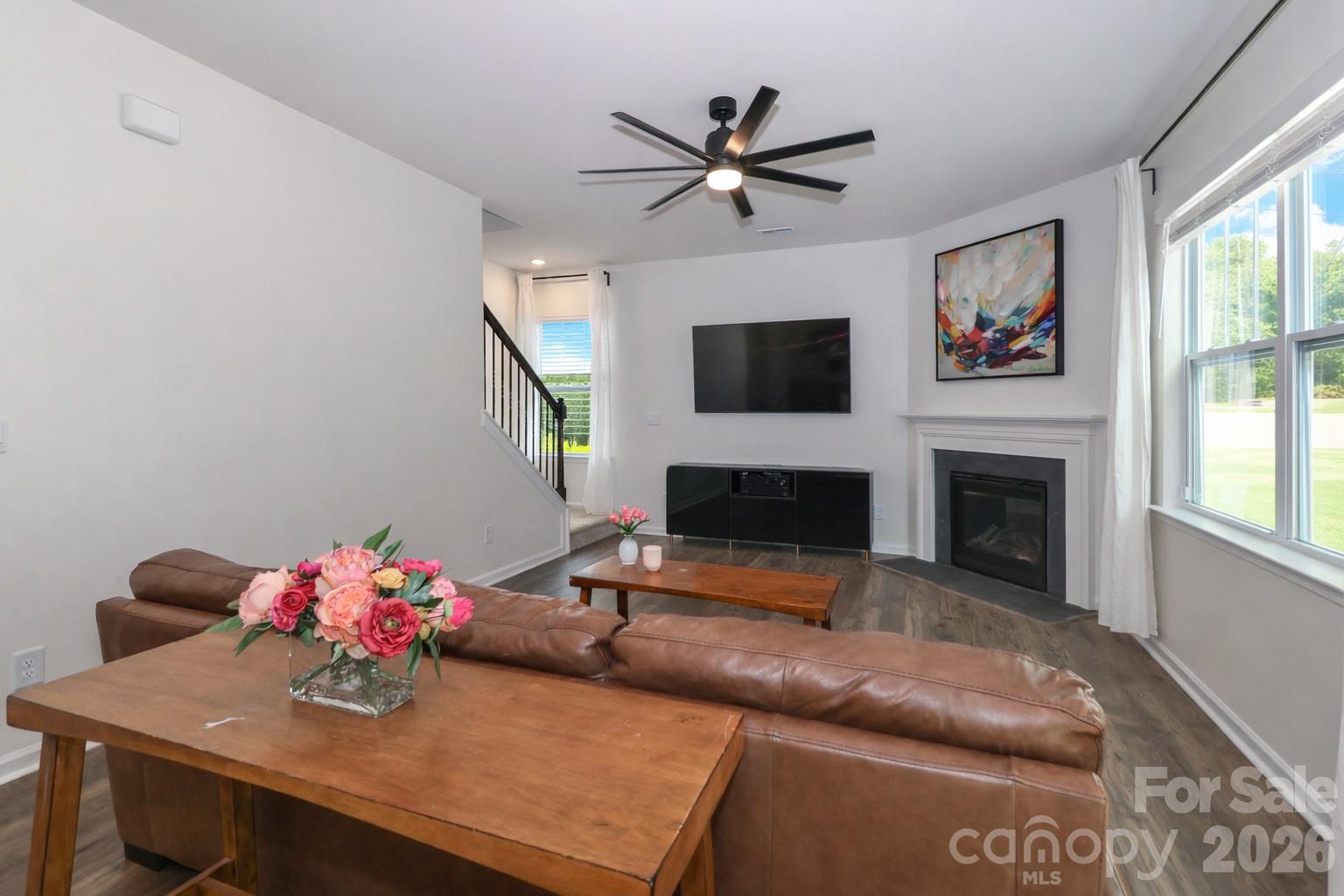 108 Kona Road, Unit 66 Mooresville, NC 28117 - Photo 22 of 47 a living room with furniture fireplace and flat screen tv