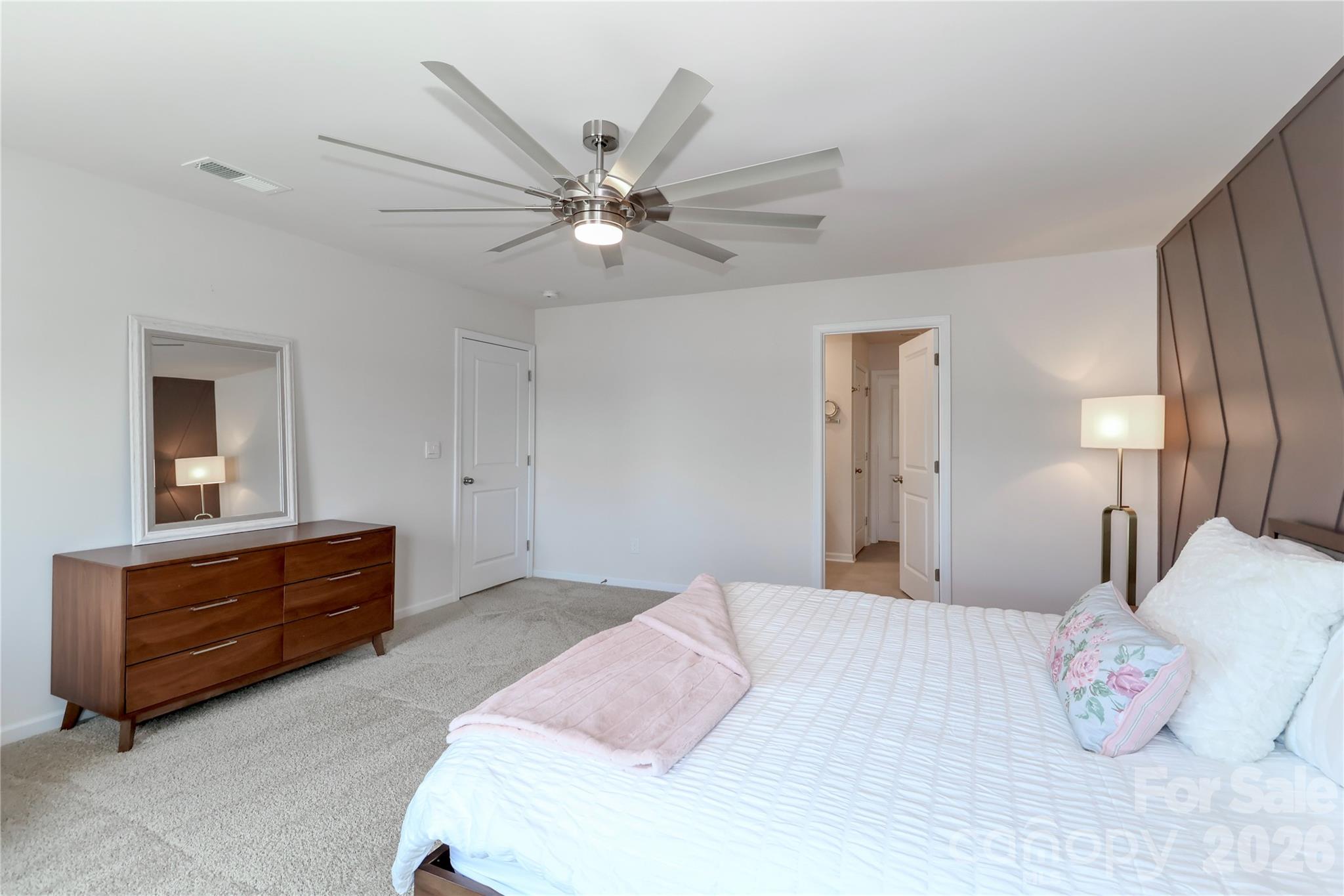 108 Kona Road, Unit 66 Mooresville, NC 28117 - Photo 28 of 47 a bedroom with a bed and a chandelier