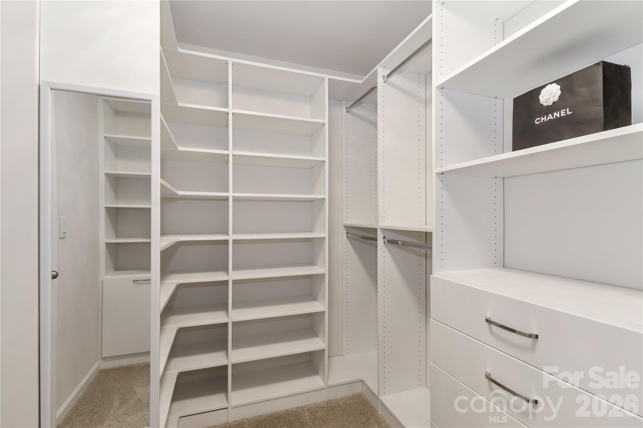 108 Kona Road, Unit 66 Mooresville, NC 28117 - Photo 32 of 47 a view of walk in closet with empty racks