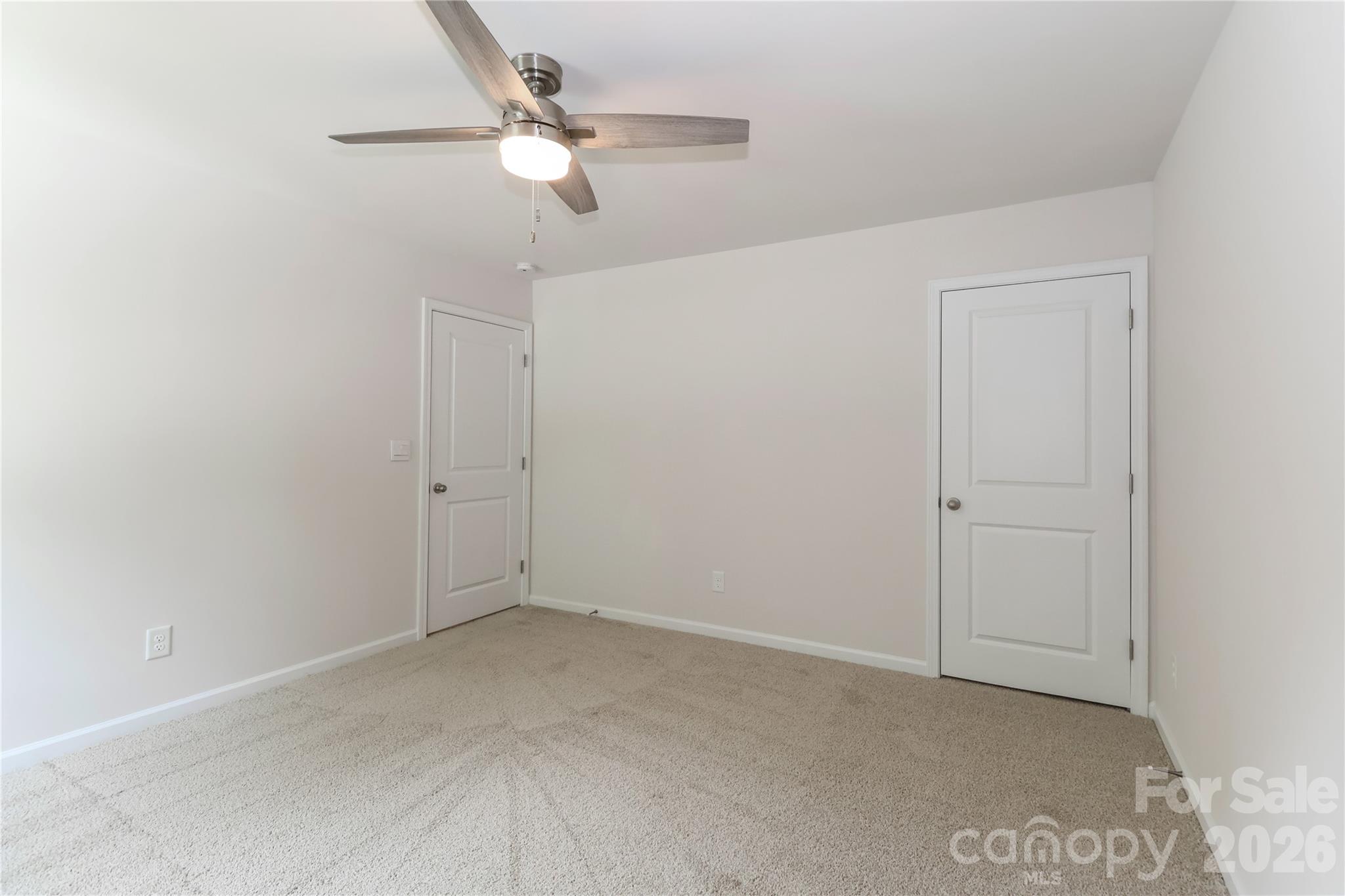 108 Kona Road, Unit 66 Mooresville, NC 28117 - Photo 34 of 47 an empty room with fan