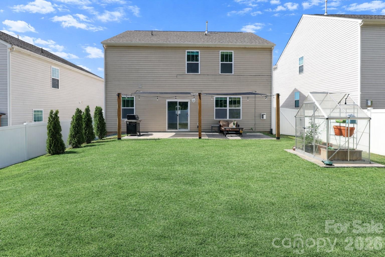 108 Kona Road, Unit 66 Mooresville, NC 28117 - Photo 40 of 47 a view of a house with a yard and sitting area