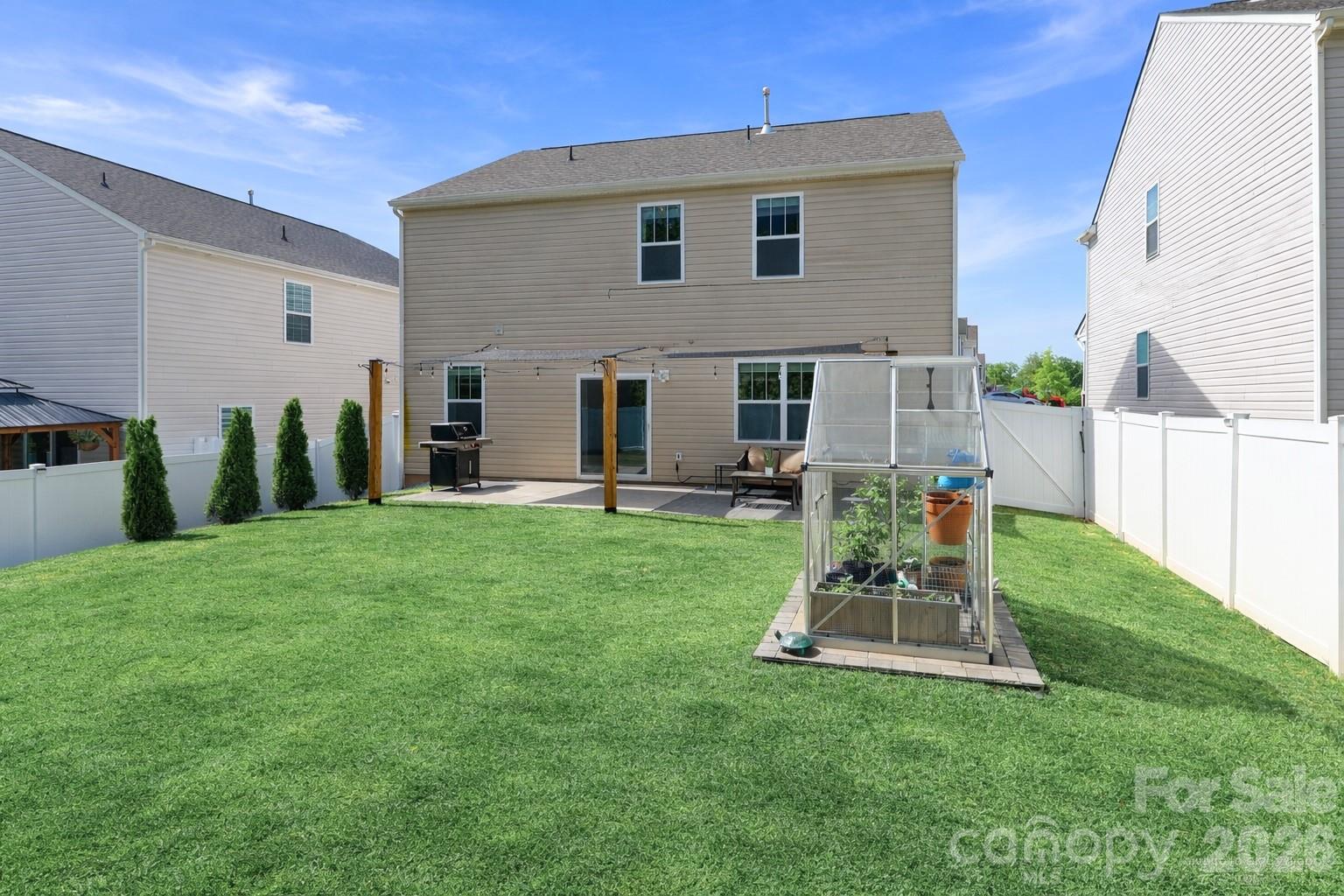 108 Kona Road, Unit 66 Mooresville, NC 28117 - Photo 41 of 47 a view of a house with backyard and a patio