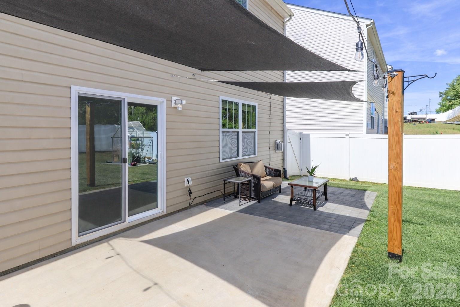108 Kona Road, Unit 66 Mooresville, NC 28117 - Photo 43 of 47 a view of a backyard with sitting area and garden