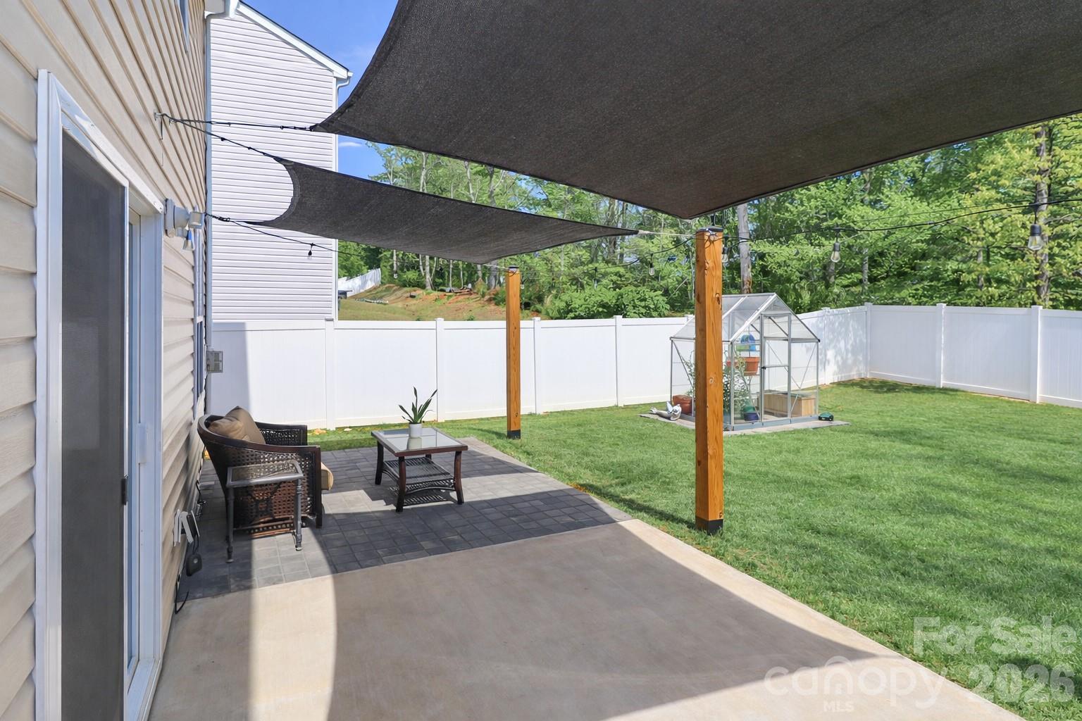 108 Kona Road, Unit 66 Mooresville, NC 28117 - Photo 46 of 47 a view of a patio with a table chairs and a backyard
