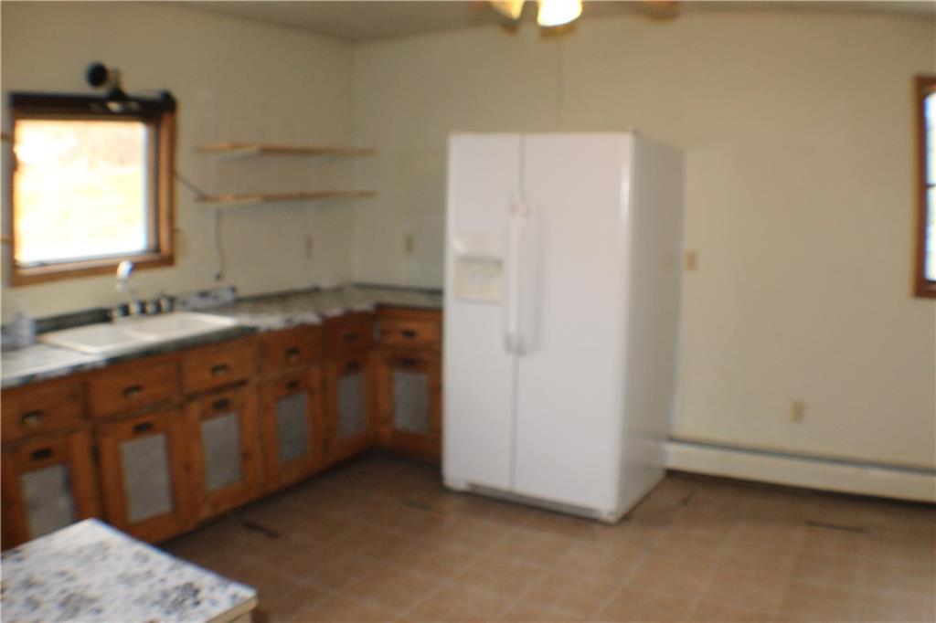 221 Ferguson Lane Perryopolis, PA 15473 - Photo 14 of 37 Rustic kitchen has lower cabinetry, open shelves above