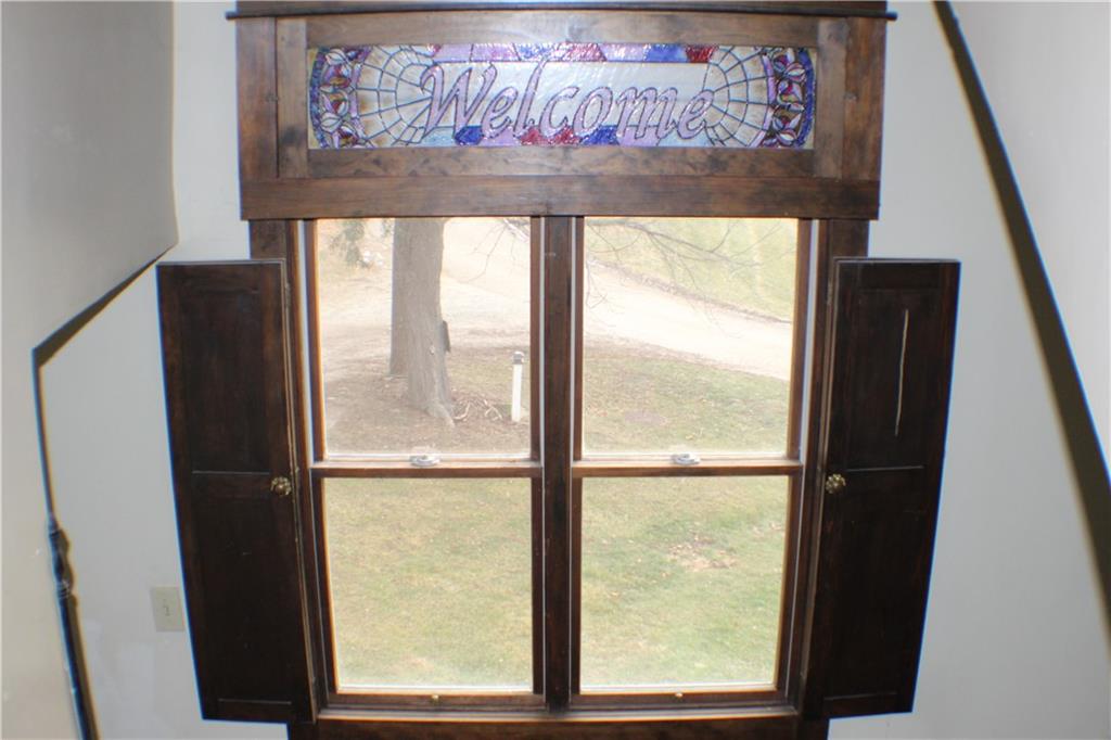 221 Ferguson Lane Perryopolis, PA 15473 - Photo 18 of 37 Stained glass panel above the window on the staircase