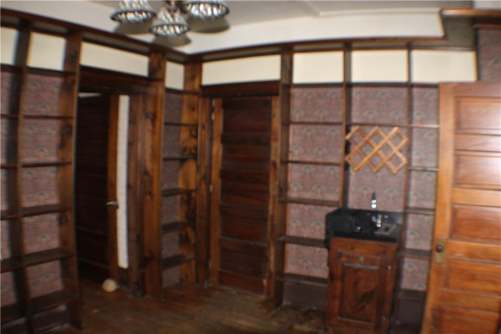 221 Ferguson Lane Perryopolis, PA 15473 - Photo 10 of 37 Covered in bookshelves, this cozy room would also be a great wine or bourbon room