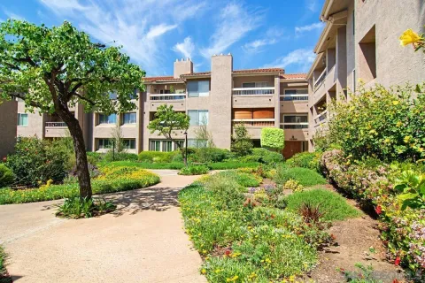 a view of a garden with a building