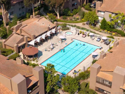 an aerial view of a house with a yard and potted plants