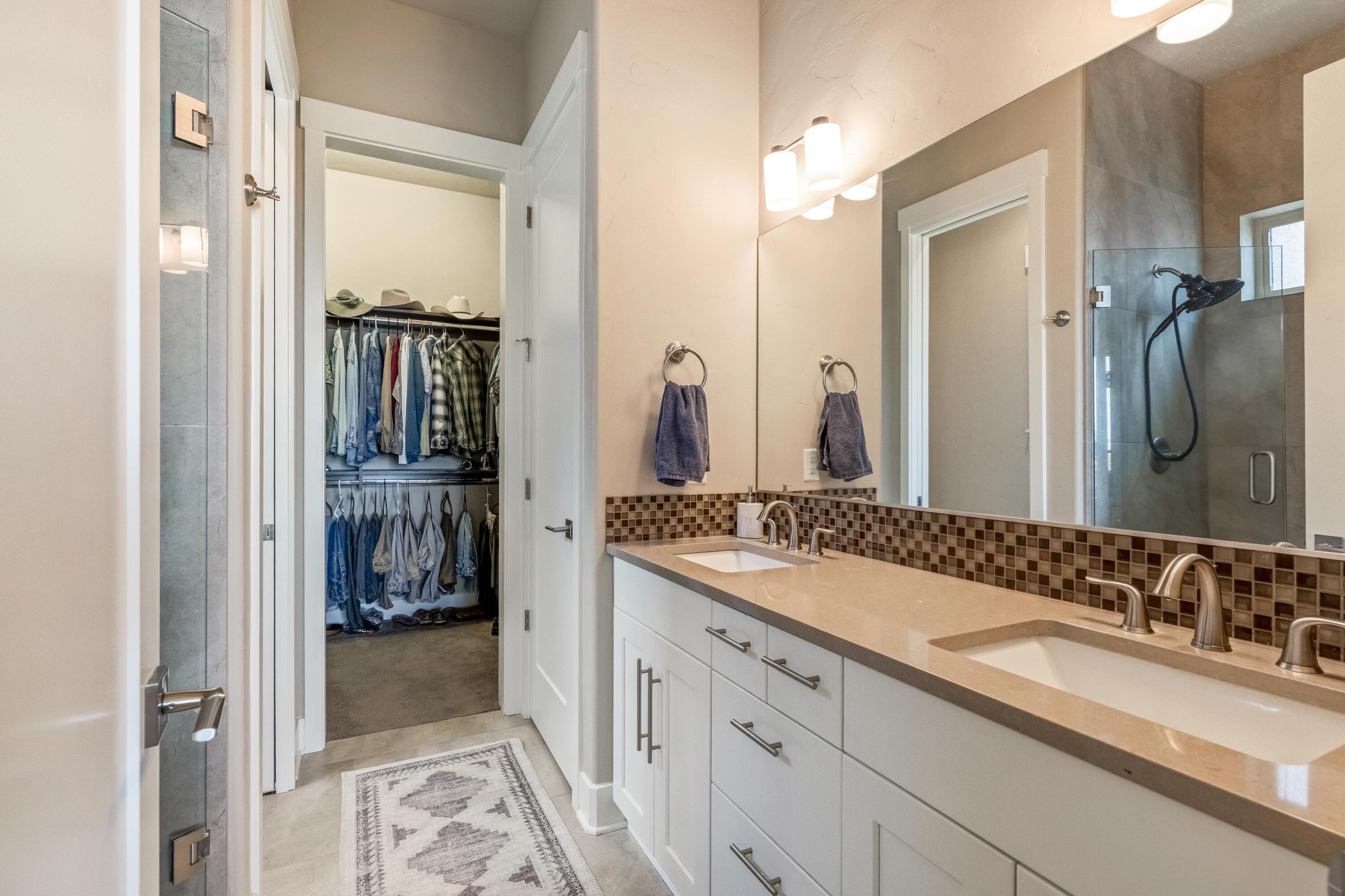 2375 Northwest Majestic Ridge Drive Bend, OR 97703 - Photo 11 of 28 a en suite bathroom with a sink and a mirror