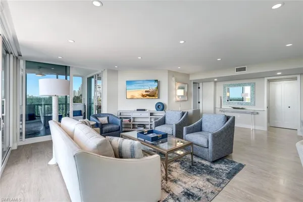 a living room with furniture and a table