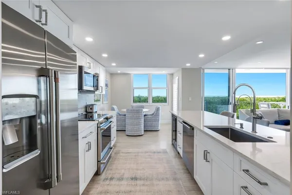 a kitchen with lots of counter top space and sink