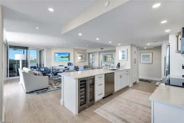 a large kitchen with stainless steel appliances lots of counter top space