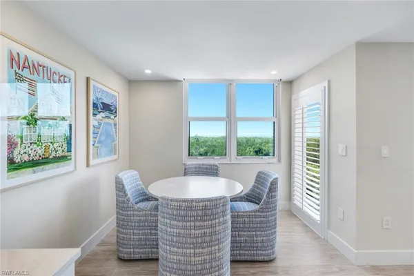 a view of a dining room with furniture window and outside view