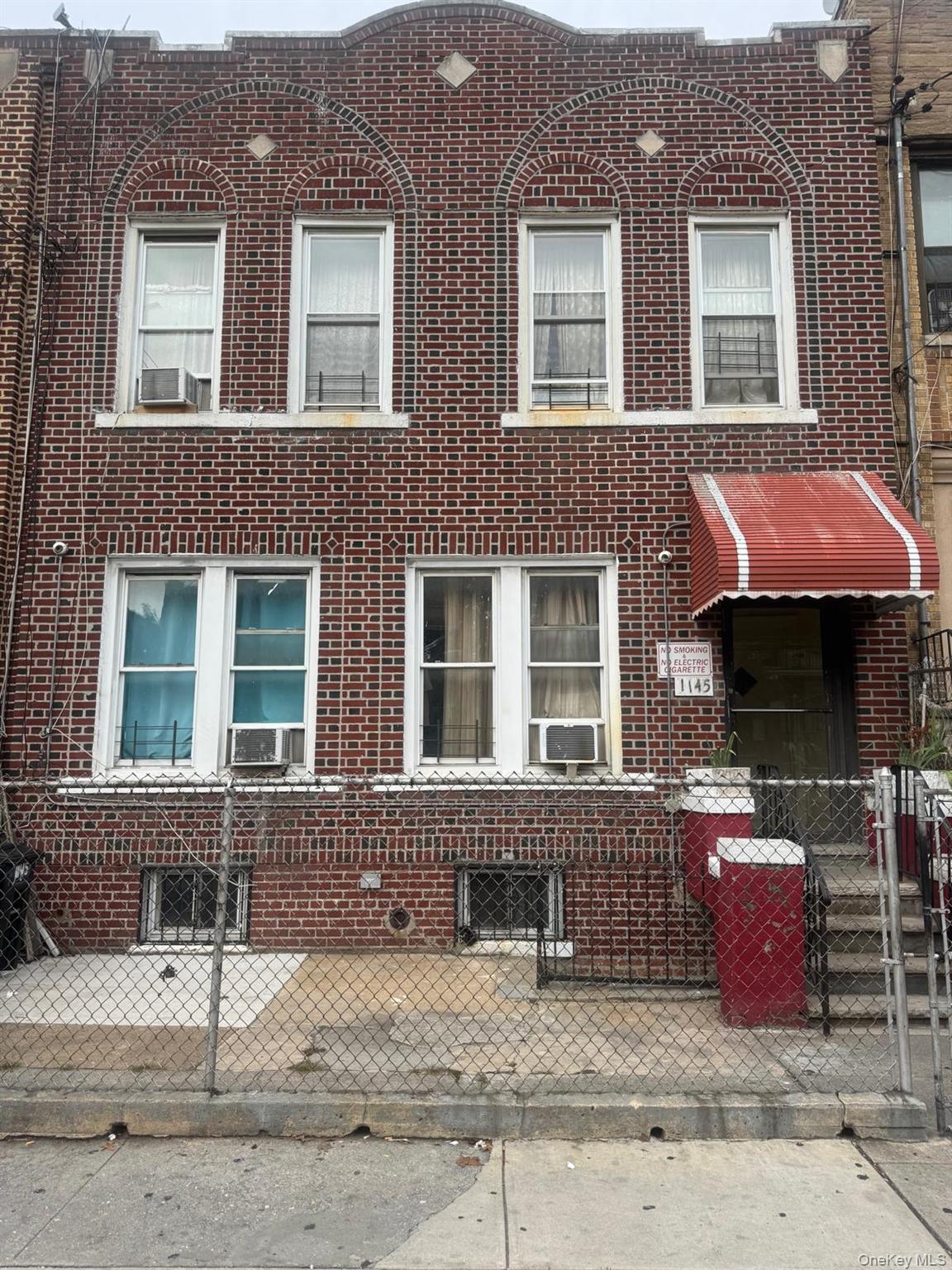 1145 Sutter Avenue Brooklyn, NY 11208 - Photo 1 of 1 a front view of a house with a outdoor space