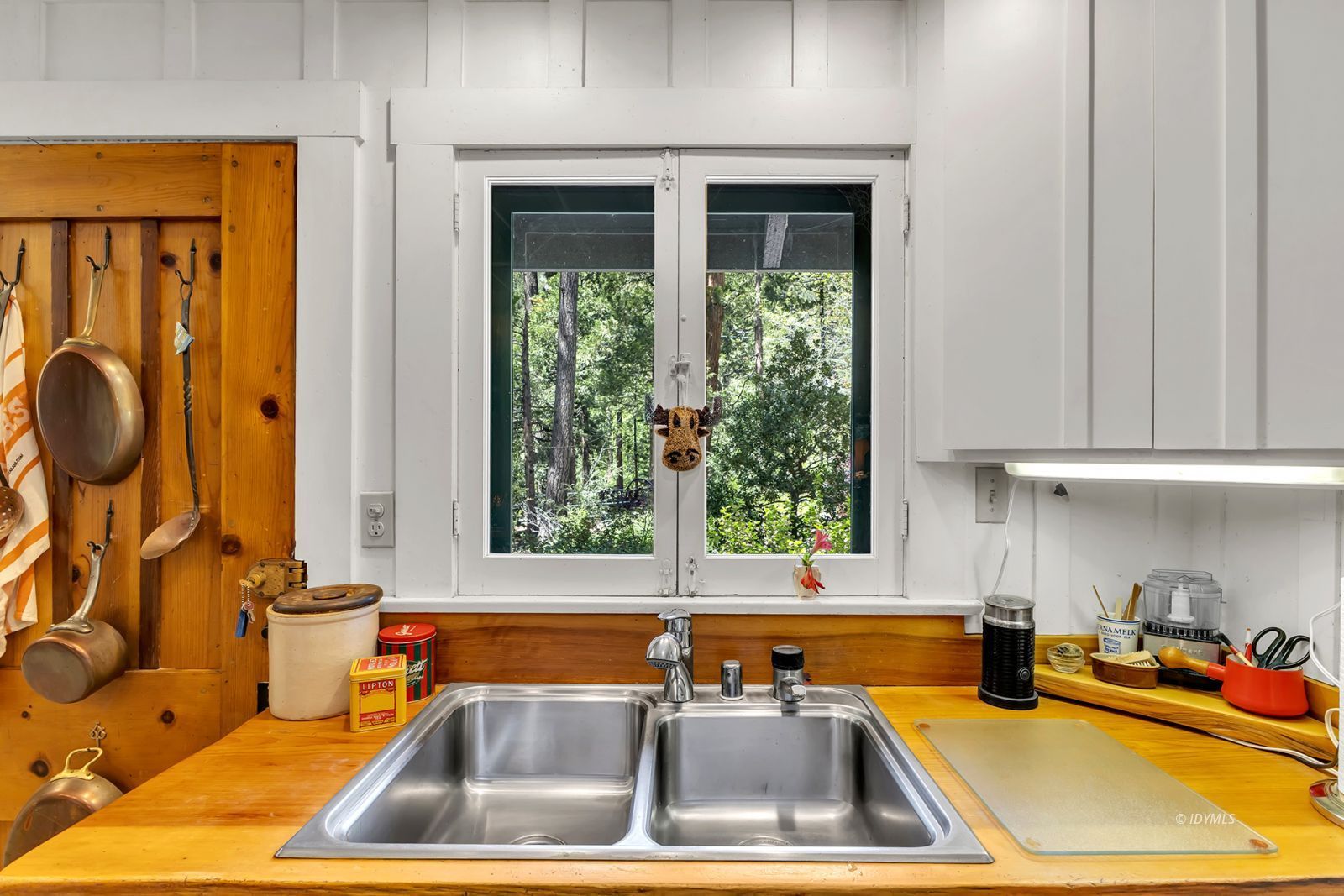 25100 Indian Rock Road Idyllwild, CA 92549 - Photo 26 of 75 a kitchen with a sink and a window