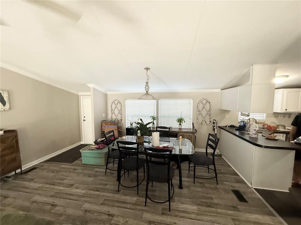 1475 Johnson Road Auburndale, FL 33823 - Photo 2 of 5 a view of a dining room with furniture window and wooden floor