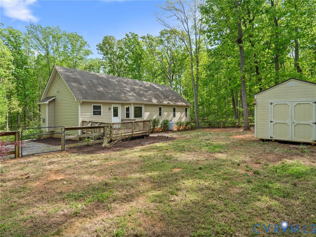 2094 Hancock Road Powhatan, VA 23139 - Photo 29 of 33 Back of house with deck and storage shed