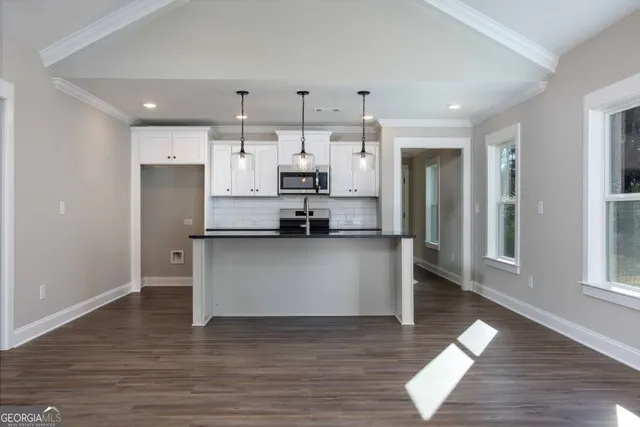 a view of kitchen view refrigerator and window