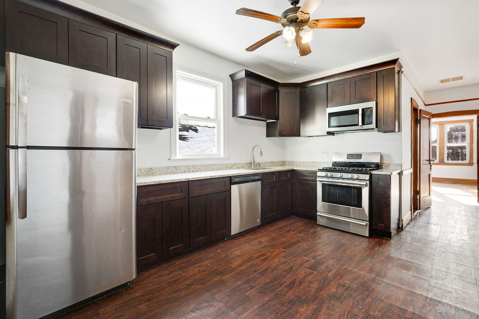 3128 West 41st Street Chicago, IL 60632 - Photo 12 of 36 a kitchen with stainless steel appliances a refrigerator sink and stove