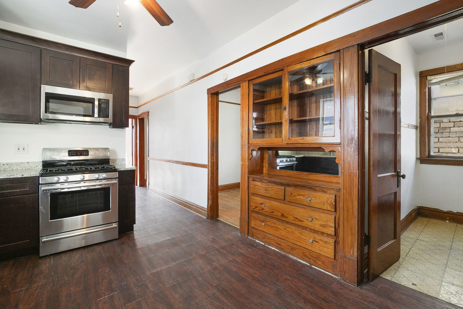 3128 West 41st Street Chicago, IL 60632 - Photo 14 of 36 a kitchen with stainless steel appliances granite countertop a stove and a refrigerator
