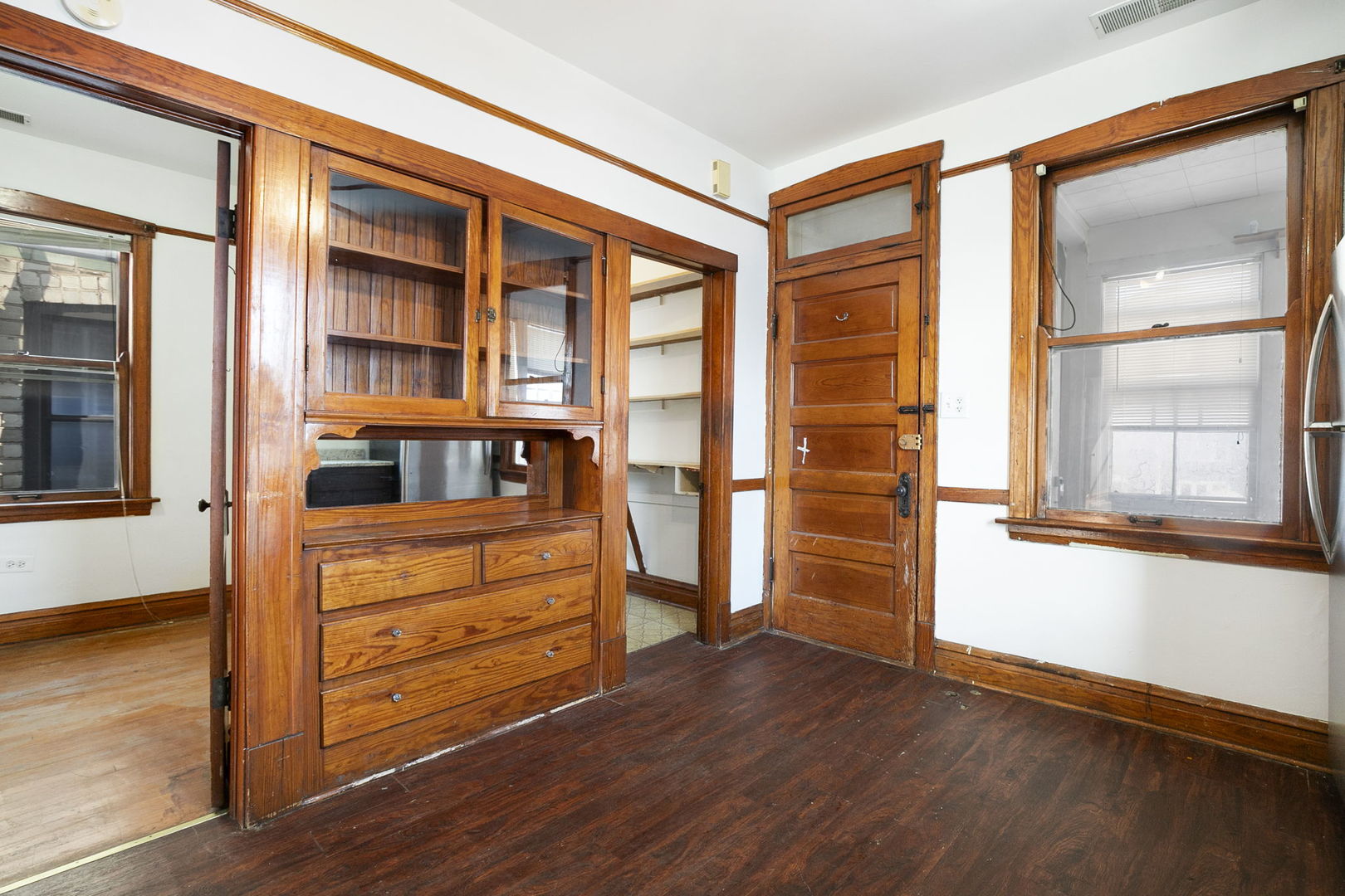 3128 West 41st Street Chicago, IL 60632 - Photo 15 of 36 a view of an empty room with a window and wooden floor