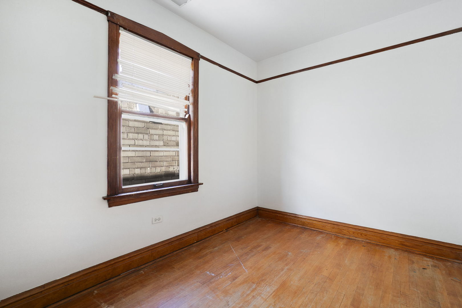 3128 West 41st Street Chicago, IL 60632 - Photo 16 of 36 a view of a room with wooden floor and a window