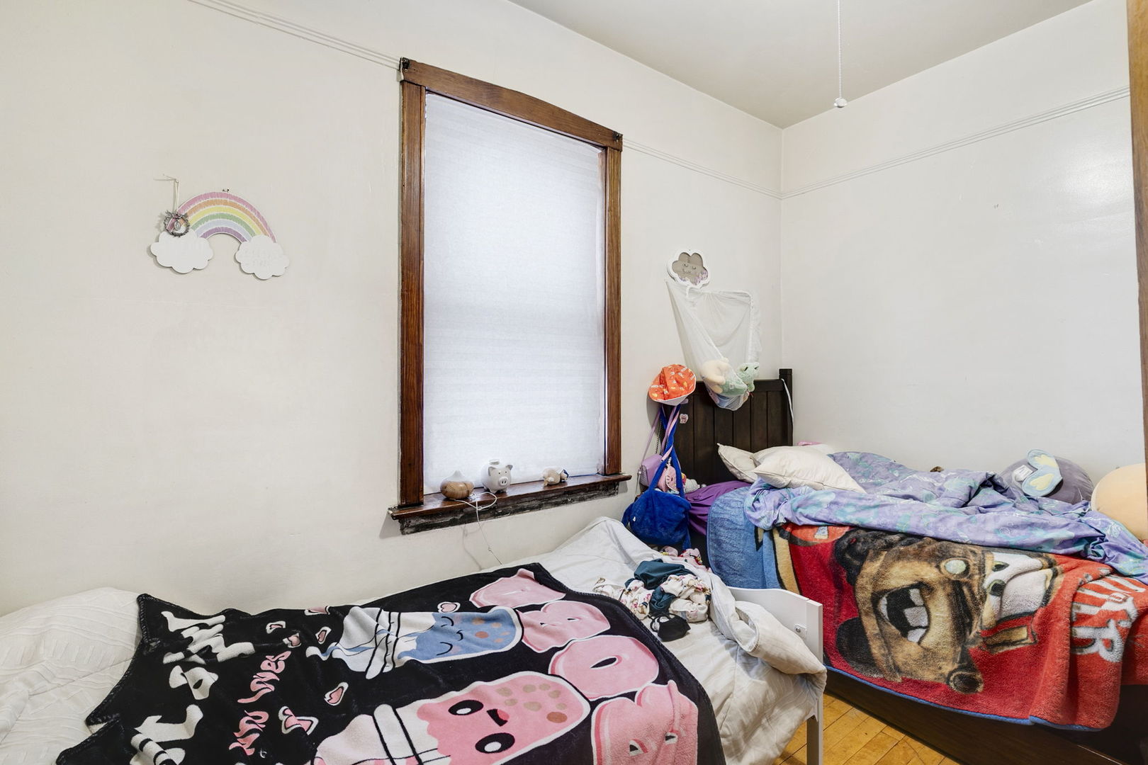 3128 West 41st Street Chicago, IL 60632 - Photo 7 of 36 a bedroom with a bed and wooden floor