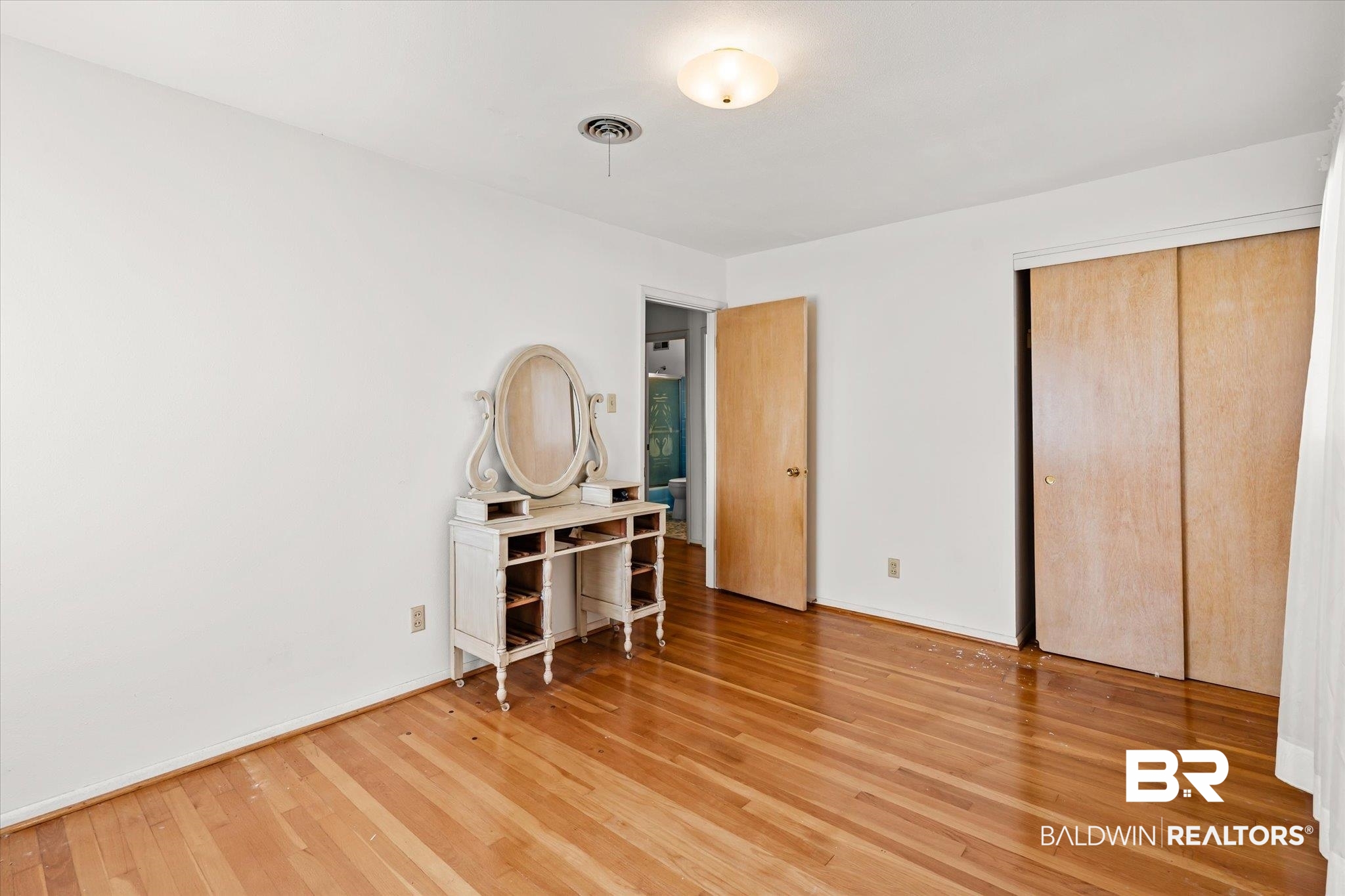 602 Markham Drive Mobile, AL 36609 - Photo 12 of 20 Bedroom featuring hardwood / wood-style floors and a closet