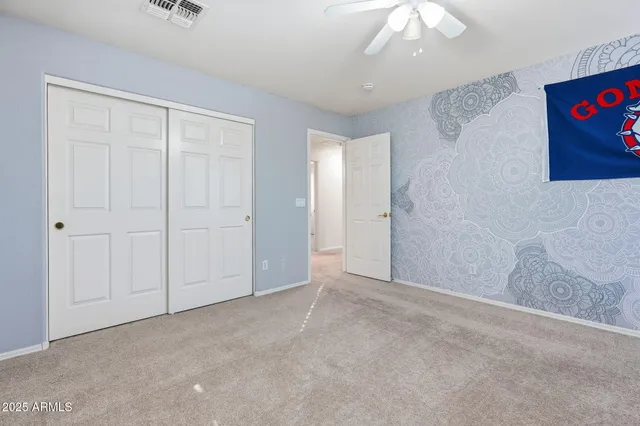 an aerial view of a house with a swimming pool