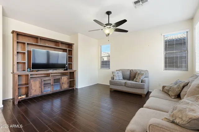 a kitchen with stainless steel appliances granite countertop a refrigerator a sink dishwasher a oven with white cabinets and a granite counter top