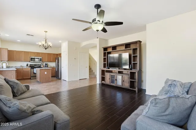 a kitchen with stainless steel appliances granite countertop a stove a sink dishwasher a refrigerator and a microwave oven