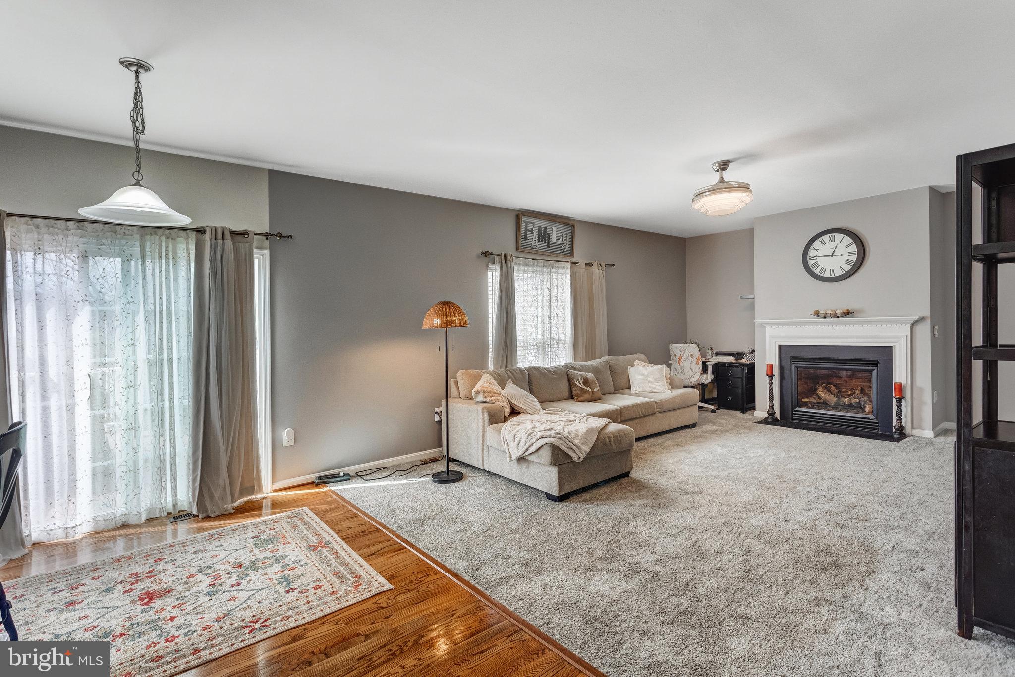 4287 Meyers Road Triangle, VA 22172 - Photo 16 of 51 a living room with furniture and a fireplace