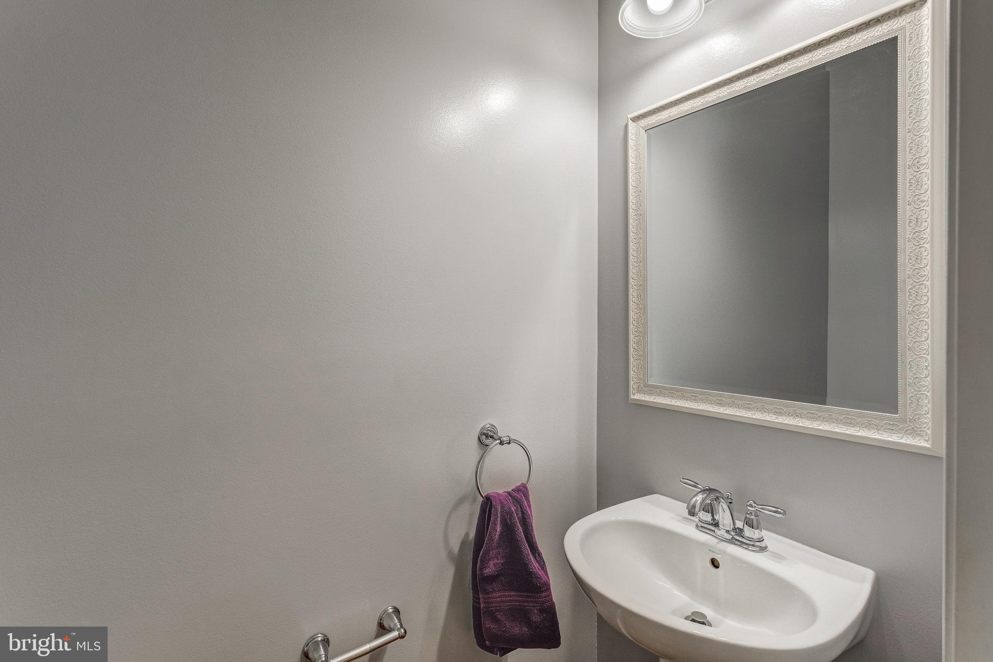 4287 Meyers Road Triangle, VA 22172 - Photo 18 of 51 a bathroom with a sink and a mirror