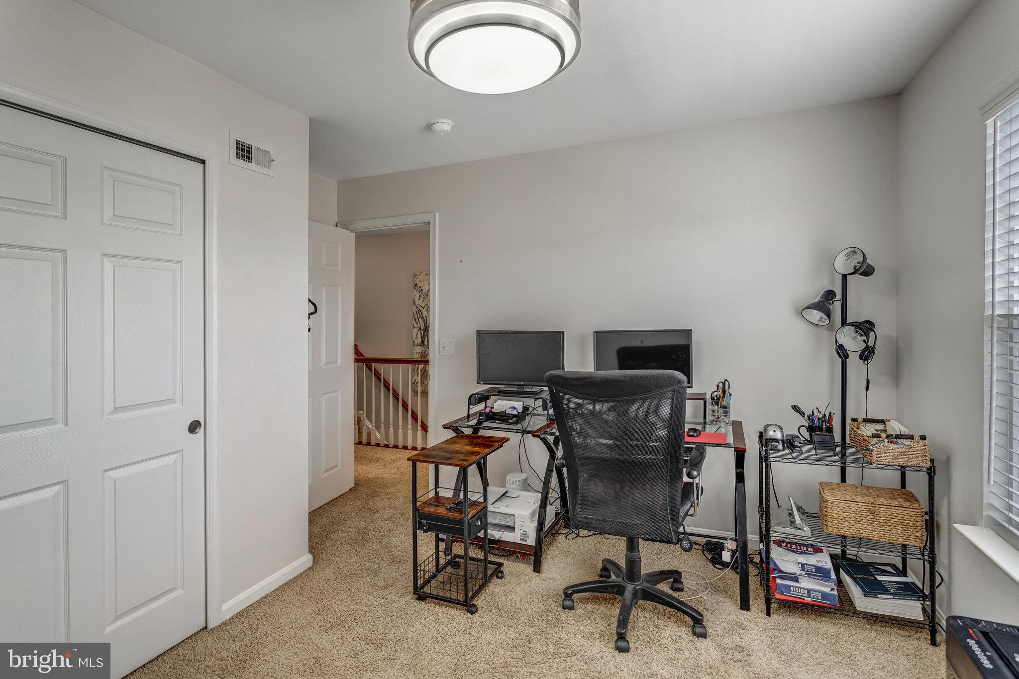 4287 Meyers Road Triangle, VA 22172 - Photo 19 of 51 a view of a workspace with furniture and a chair