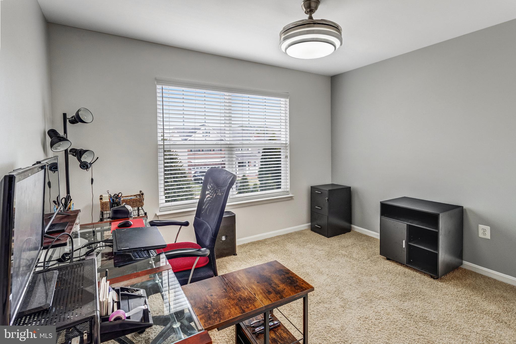4287 Meyers Road Triangle, VA 22172 - Photo 20 of 51 a view of a workspace with furniture and a window