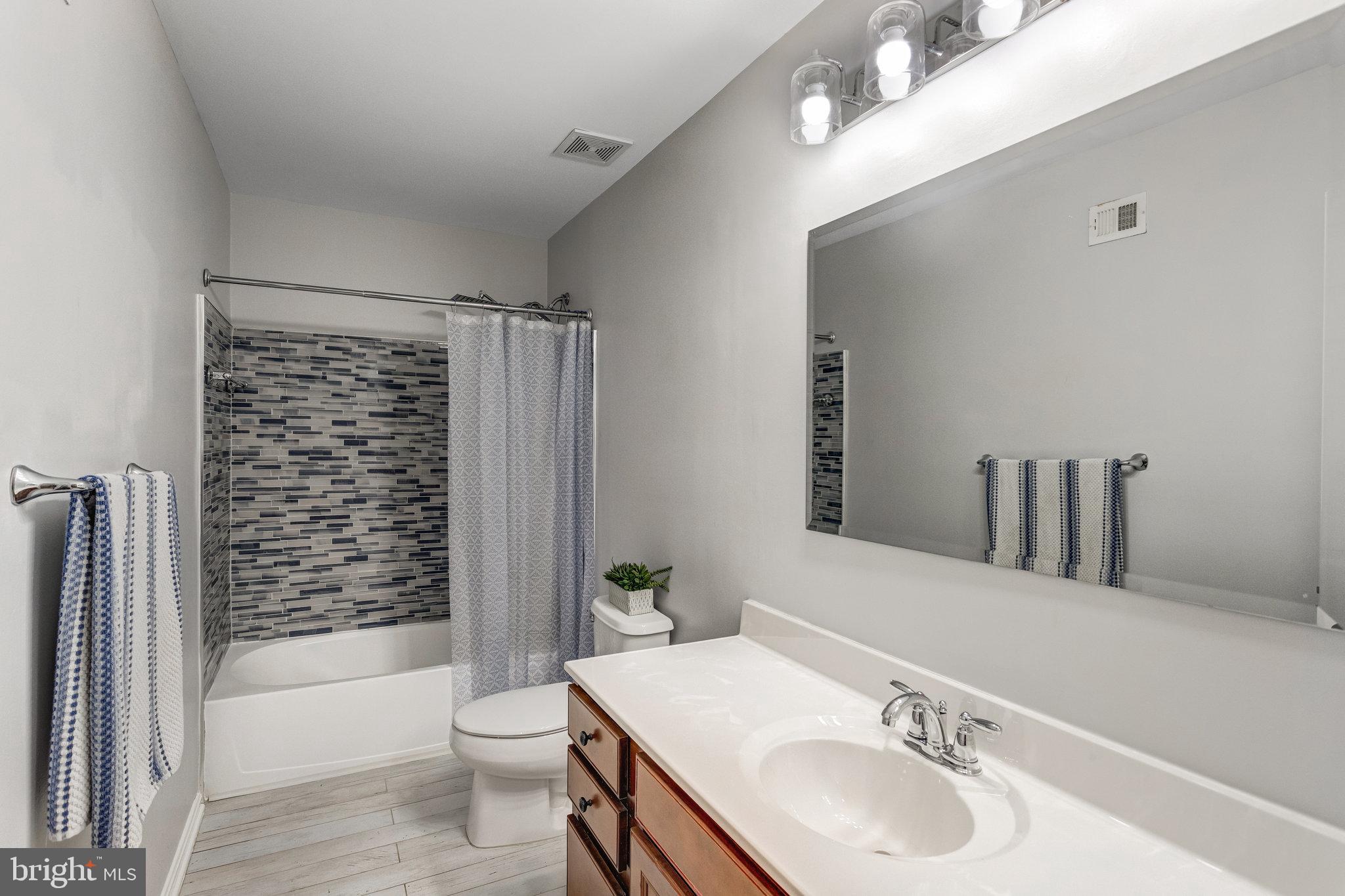 4287 Meyers Road Triangle, VA 22172 - Photo 21 of 51 a bathroom with a sink toilet and shower