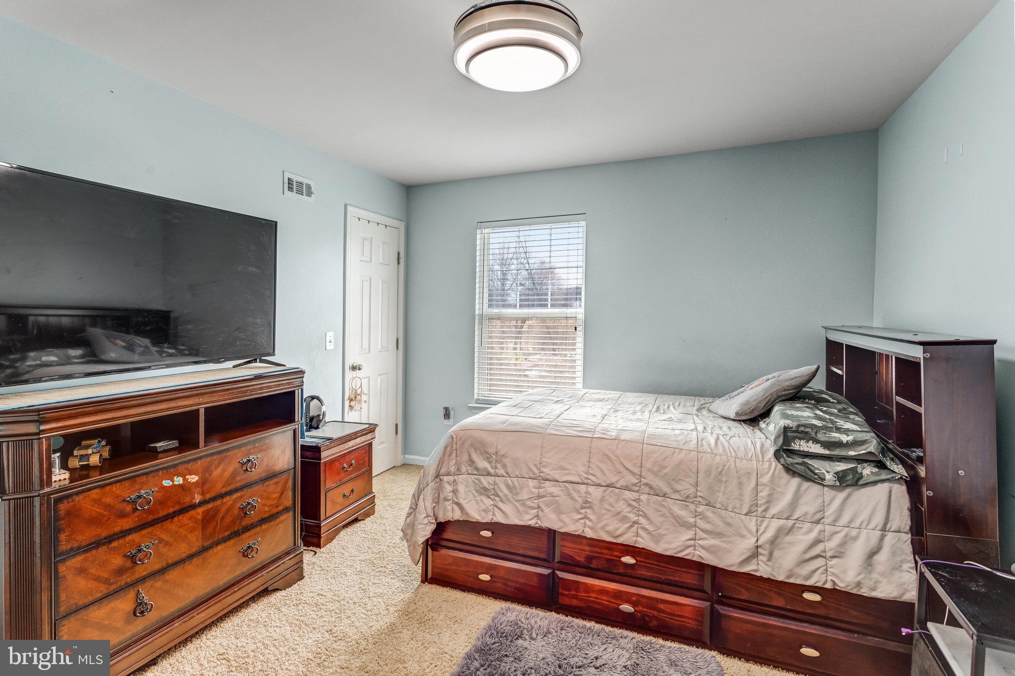 4287 Meyers Road Triangle, VA 22172 - Photo 25 of 51 a bedroom with a bed and a dresser