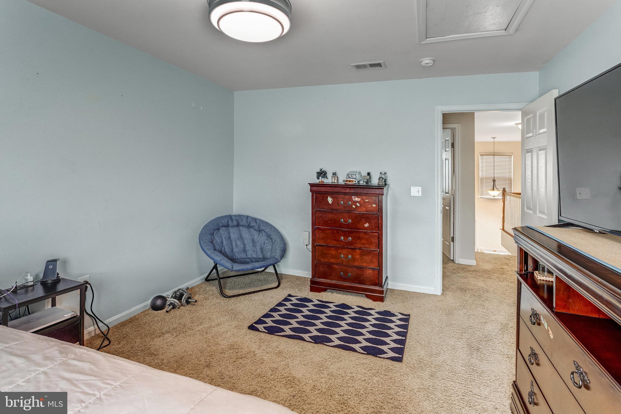 4287 Meyers Road Triangle, VA 22172 - Photo 26 of 51 a hallway with a stove a dining table and chairs