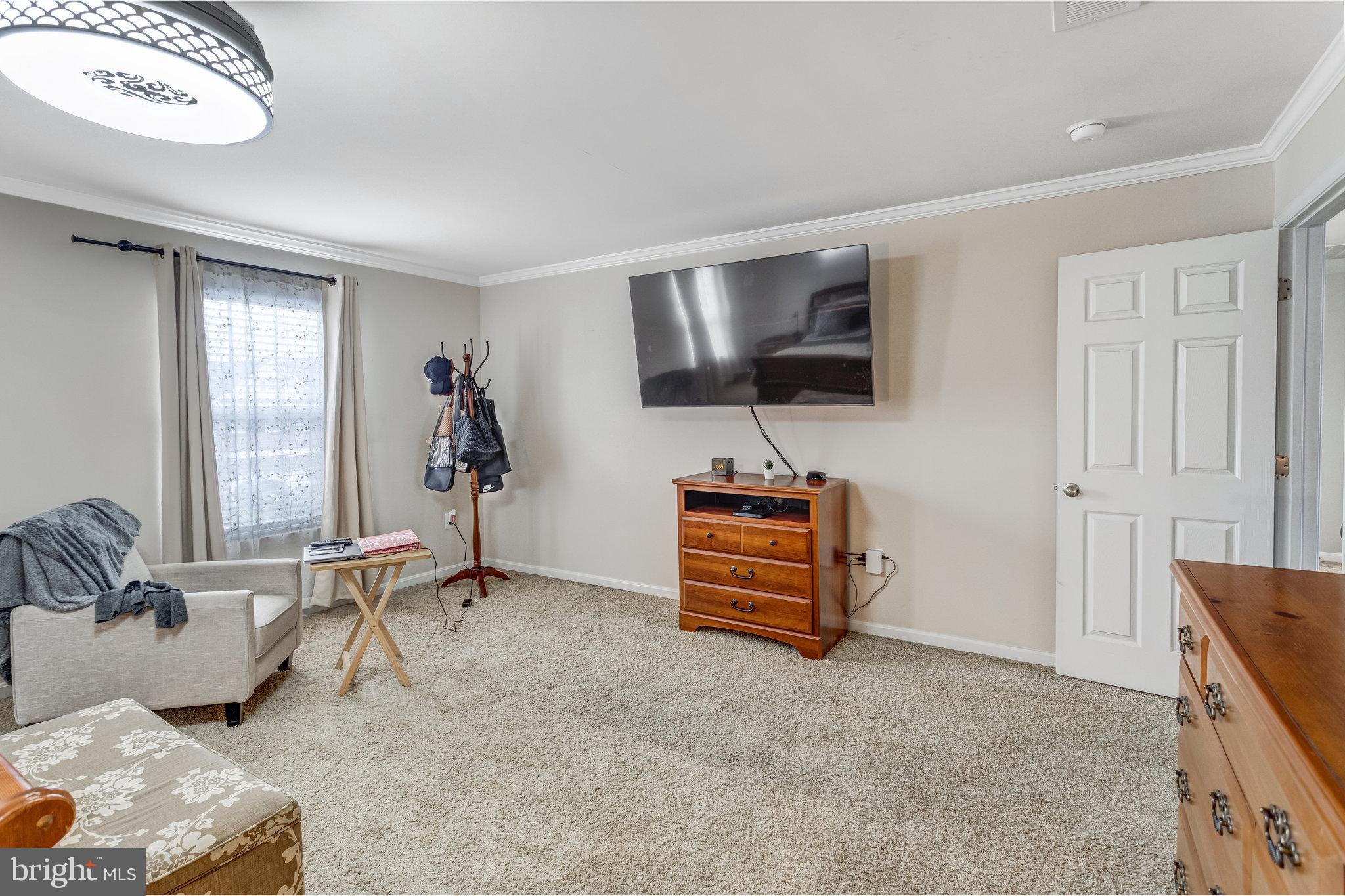 4287 Meyers Road Triangle, VA 22172 - Photo 30 of 51 a view of a livingroom with furniture and a flat screen tv