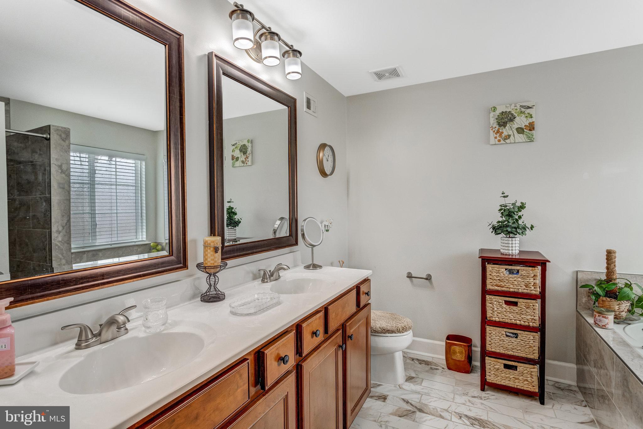 4287 Meyers Road Triangle, VA 22172 - Photo 32 of 51 a bathroom with a sink double vanity and a toilet