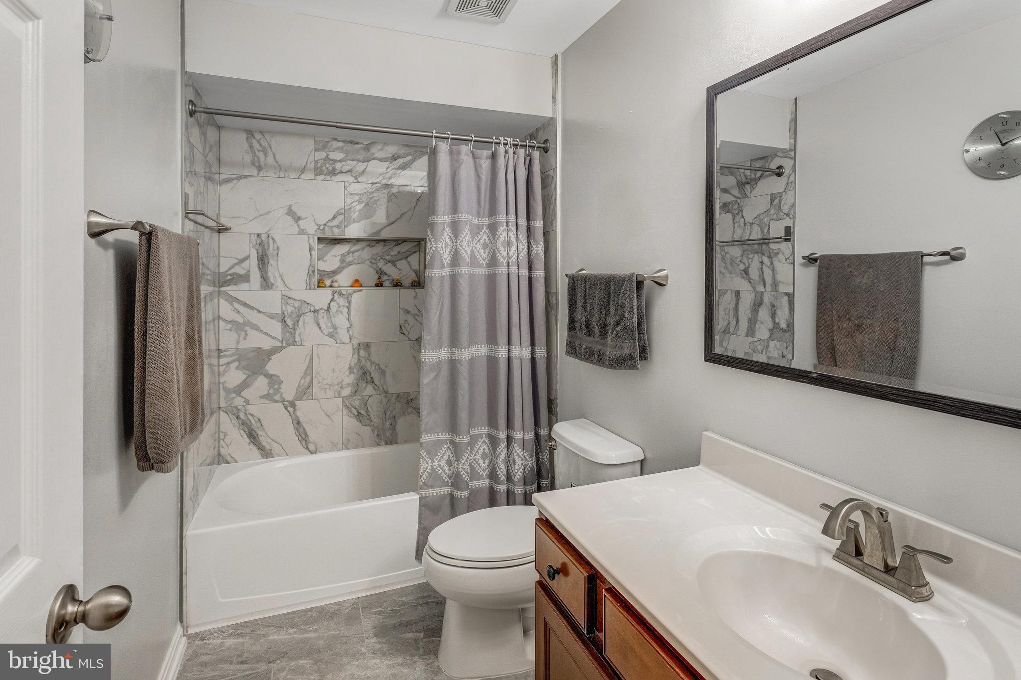 4287 Meyers Road Triangle, VA 22172 - Photo 35 of 51 a bathroom with a sink toilet and shower