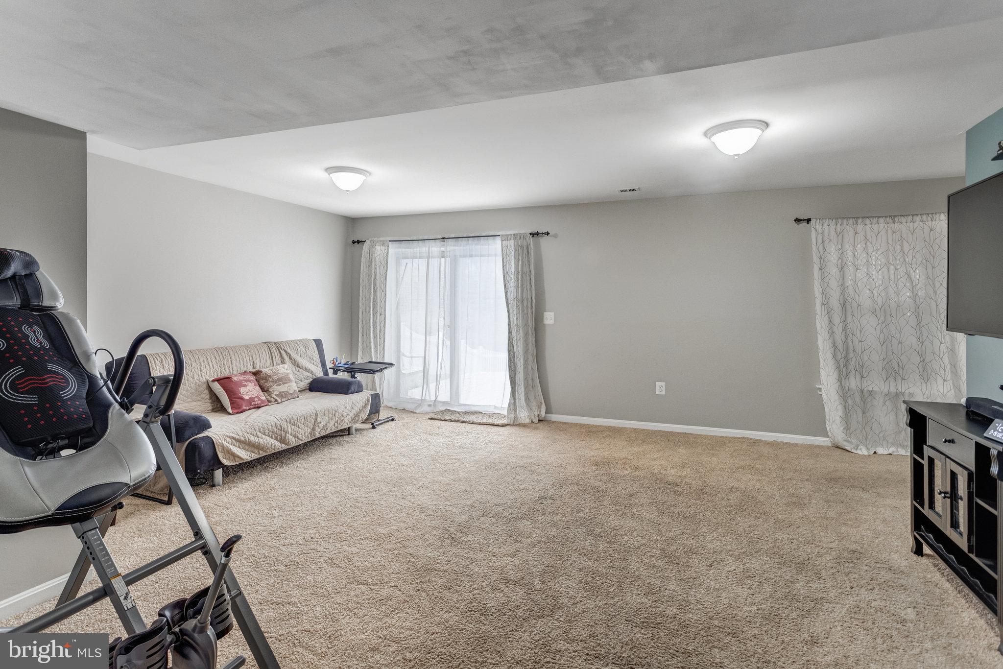 4287 Meyers Road Triangle, VA 22172 - Photo 40 of 51 a living room with furniture and a flat screen tv