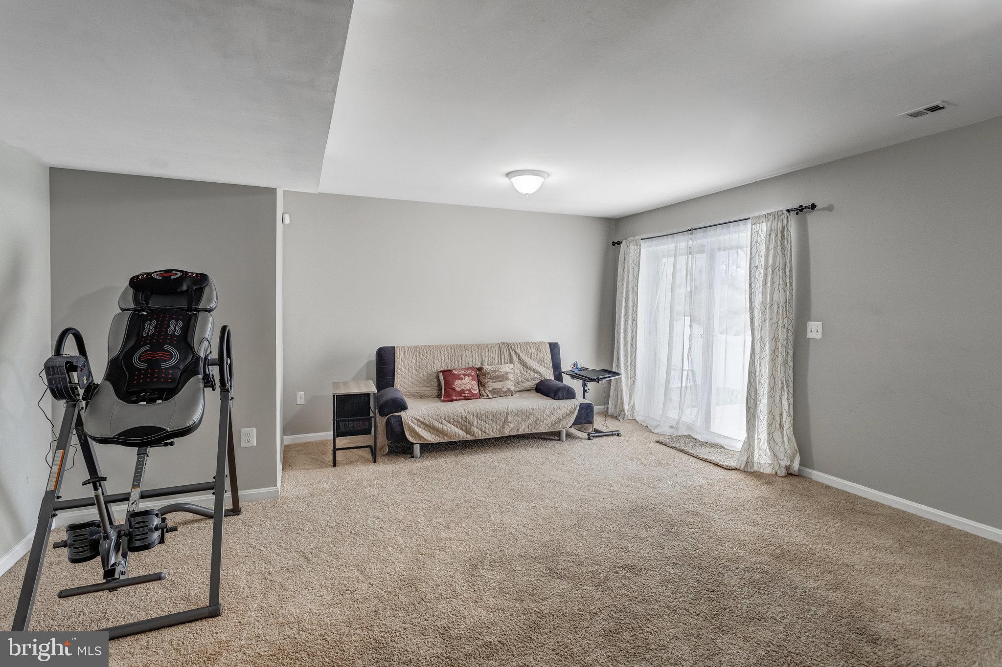 4287 Meyers Road Triangle, VA 22172 - Photo 41 of 51 a living room with furniture and a gym machine