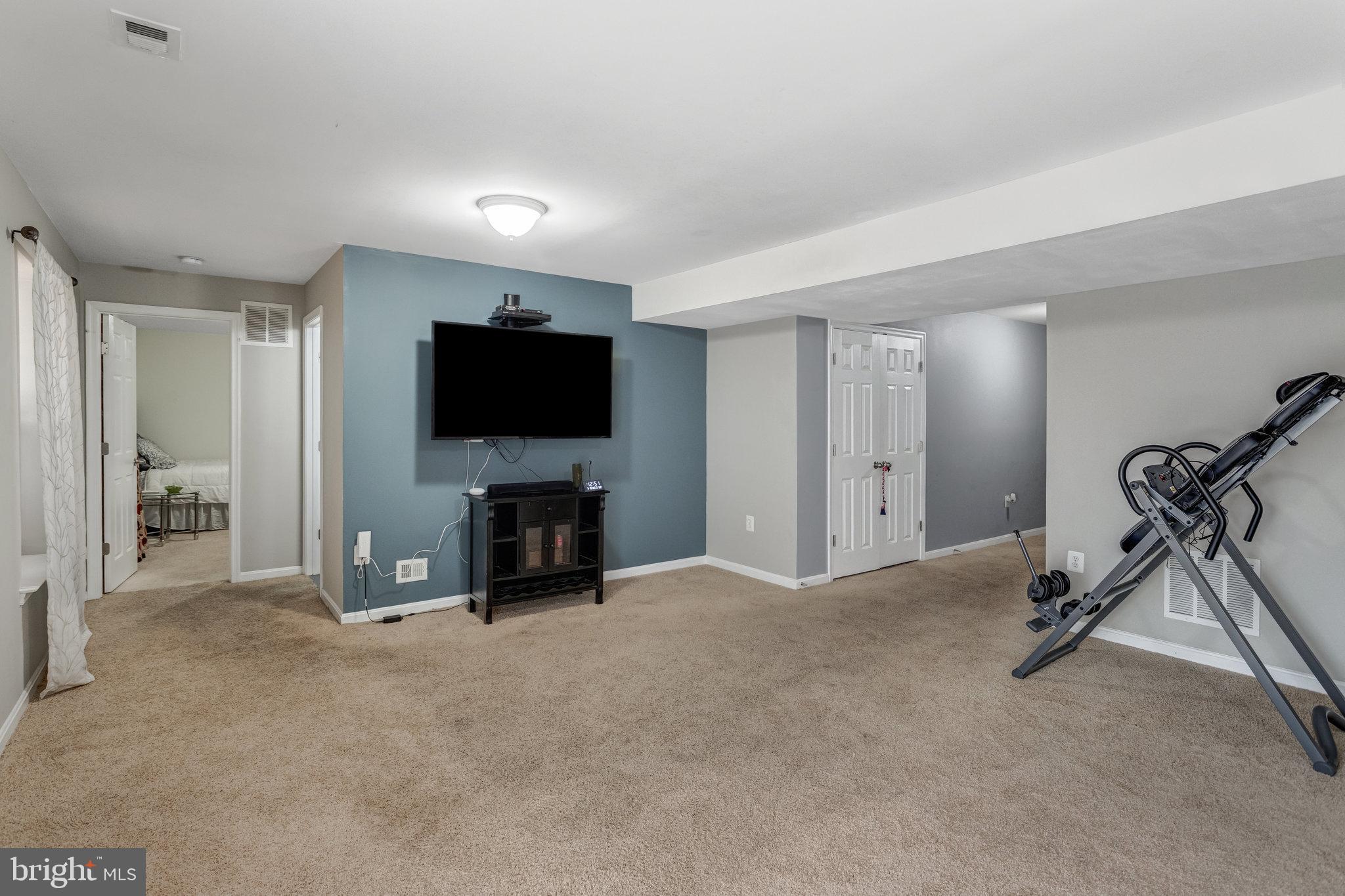 4287 Meyers Road Triangle, VA 22172 - Photo 42 of 51 a view of a livingroom with entryway and a flat screen tv