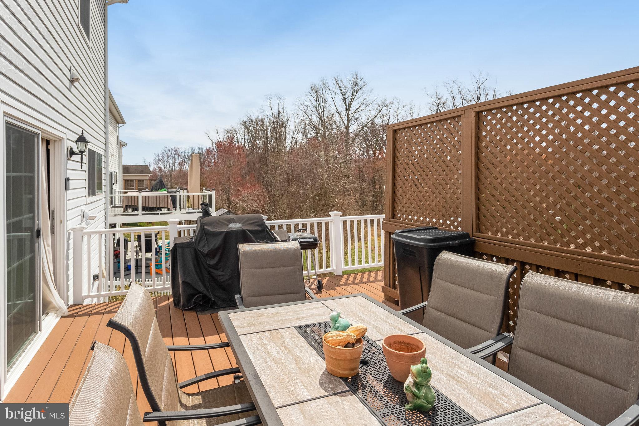 4287 Meyers Road Triangle, VA 22172 - Photo 44 of 51 a view of a patio with couches chairs and wooden floor