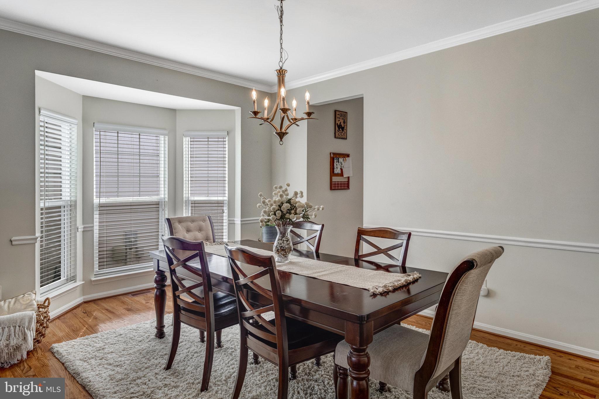 4287 Meyers Road Triangle, VA 22172 - Photo 8 of 51 a view of a dining room with furniture window and wooden floor